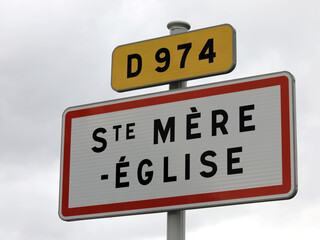 French road sign indicating the place where  the paratrooper hanging from the bell tower who fell...