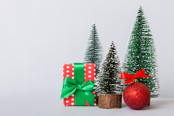 Christmas composition. craft Gift box, small tree, branches and craft DIY decorations on white background. New year concept. Christmas home decoration Flat lay, top view, copy space