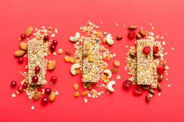 Various granola bars on table background. Cereal granola bars. Superfood breakfast bars with oats, nuts and berries, close up. Superfood concept