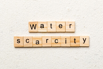Water scarcity word written on wood block. Water scarcity text on cement table for your desing, concept