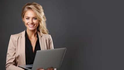 Foto op Plexiglas Smiling blonde businesswoman holding laptop computer © pariketan