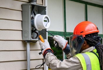 An electrical technician removes the old Power Meter and replaces it with a new Smart Meter at our...