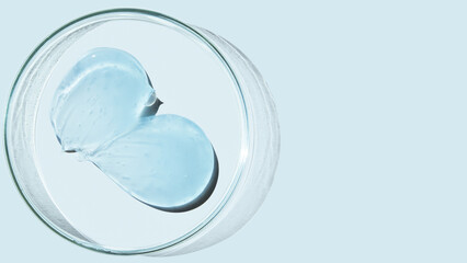 Petri dish and drops and ointments of transparent gel or serum on a blue background. Banner with...