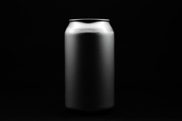 soda can in the center of the image with a black background