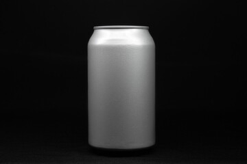 soda can in the center of the image with a black background