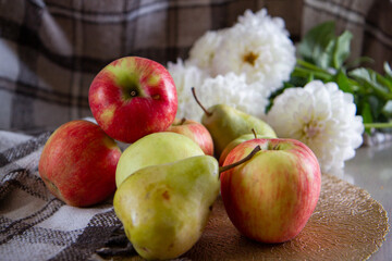 bright fresh apples and flowers on the table