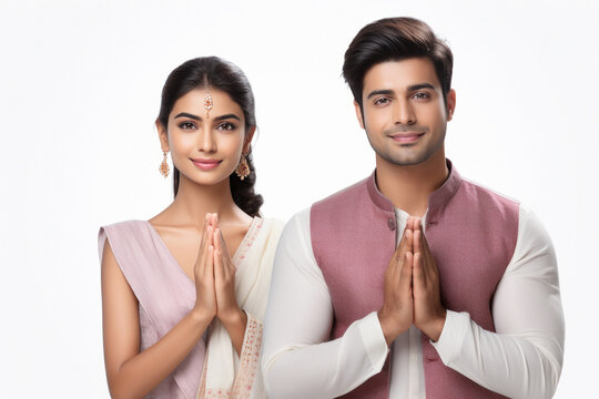 indian couple doing namaste or welcoming gesture.