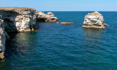 Fototapeta premium Steep coast with karst caves and grottoes near the village of Tyulenovo, Bulgary