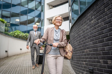 Fototapeta premium senior couple man and woman in front of modern building hotel