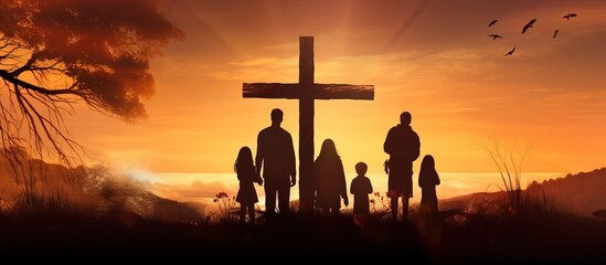Christian family seeking cross amidst autumn sunrise