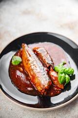 mackerel in tomato sauce and basil fresh canned fish delicious seafood healthy eating cooking appetizer meal food snack on the table copy space