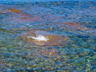 Beautiful view of the sea, rocks, and seabed of the Mediterranean Sea on the island of Crete in Greece.
