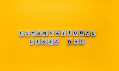 December 5, Ninja day, minimalistic banner with the inscription in wooden letters
