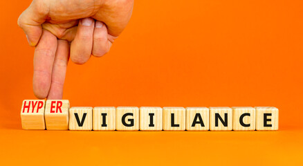 Vigilance or hypervigilance symbol. Concept words Vigilance Hypervigilance on wooden blocks....