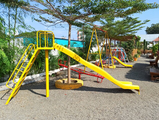 empty children play area with various equipment