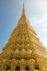 Golden pagoda as a part of a buddhist temple in Bangkok
