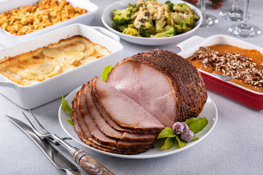 Holiday dinner with honey glazed spiral cut ham and all the sides