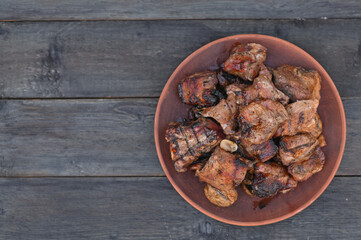 grilled pork ribs lie on a plate.