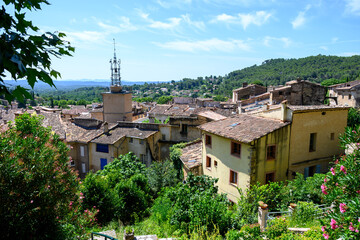 Travel destination, small ancient village Cotignac in Var, Provence, surrounded by vineyards and cliffs with troglodytes houses.