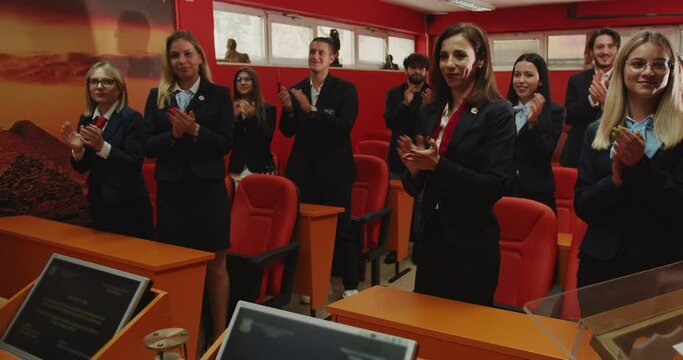 Applauding standing up to affirm success