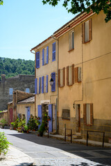 Travel destination, small ancient village Cotignac in Var, Provence, surrounded by vineyards and cliffs with troglodytes houses.