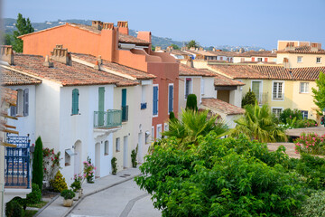 Colorful houses in Port Grimaud, village on Mediterranean sea with yacht harbour, Provence, summer vacation France