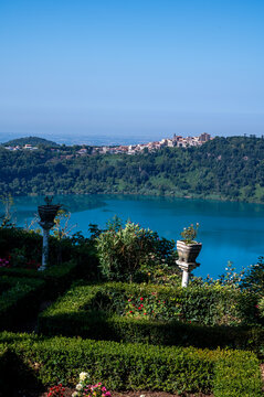 Small historical town Nemi, view on green Alban hills overlooking volcanic crater lake Nemi, Castelli Romani, Italy in summer