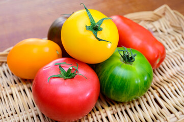 Variety of colorful tasty ripe french tomatoes on farmers market in Provence in summer close up