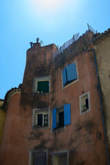 Travel destination, small ancient village Cotignac in Var, Provence, surrounded by vineyards and cliffs with troglodytes houses.