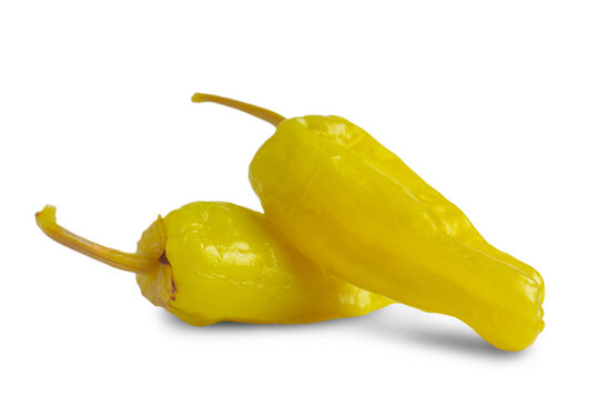 Two pickled yellow peppers, pepperoncini or friggitelli isolated on transparent background, PNG. Hot pepper marinated, brined. Traditional Italian and greek cuisine, ingredient for salad, pasta, sauce