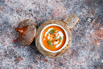 Fototapeta premium Traditional autumn butternut squash soup with seeds.