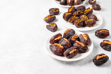 Fresh organic and various sweet dried date fruits.
