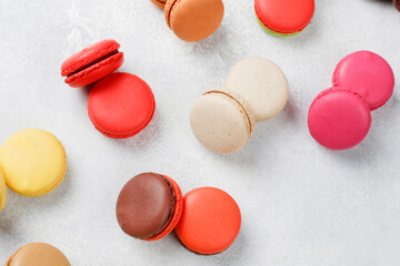 Colorful french dessert macarons with fresh fruits and nuts.