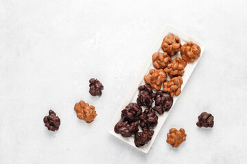 Handmade chocolate with pistachios, dark and milk chocolate pieces.