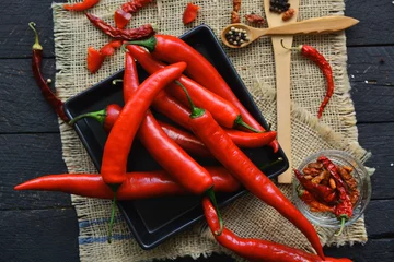Fotobehang Red  hot chili pepper composition, spicy organic paprika background © RomanWhale studio