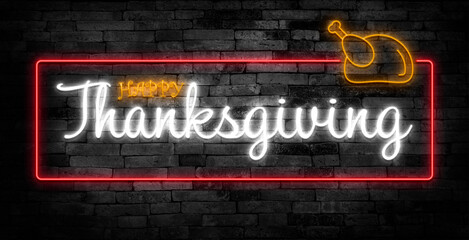 Fototapeta premium Happy thanksgiving day neon sign. Greeting card on brick wall background.