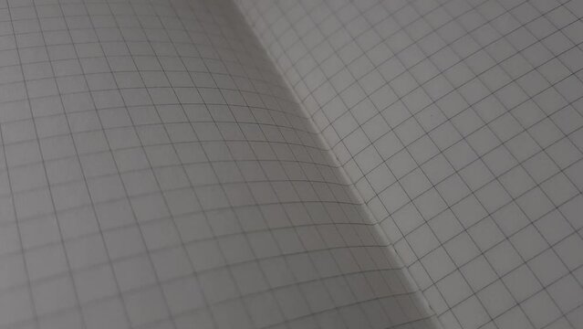 Closeup opened notebook in a cage
