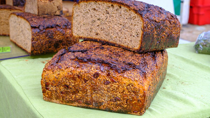 Whole wheat bread baked at home, bio ingredients, very healthy with seeds at the farmer's market