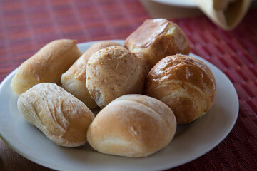 Small pieces of bread on a white dish breakfast time at hotel Peru