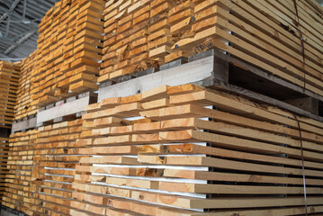 stacked pallets in warehouse. Wood industry