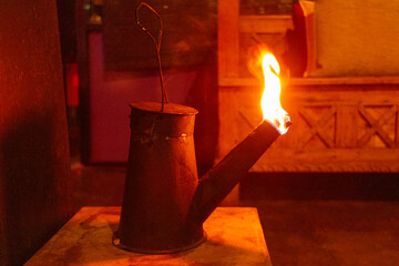 A traditional oil lamp is creating a fantastic atmospheric lighting in the restaurant