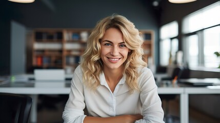 Successful Businesswoman in Office: Portrait of a Beautiful Happy Woman Looking at the Camera While Sitting at her Desk
