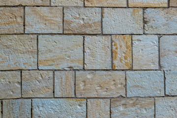 Surface of regular rectangular sandstone stones