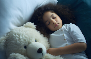 A Small Child Asleep With a Stuffed Animal