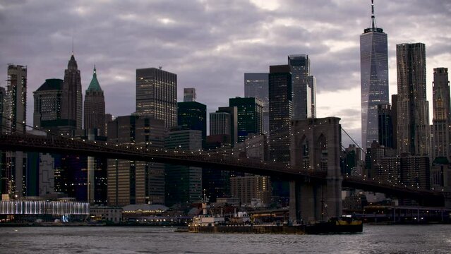 Telephoto Shot of Brooklyn Bridge and Financial District Across East River at Dusk