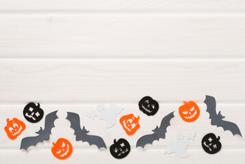Halloween decoration on wooden background, top view