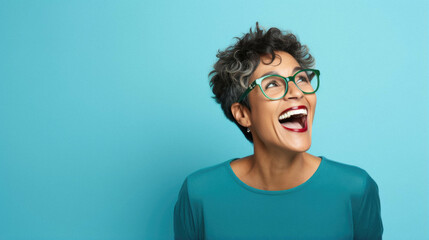 Middle age mature happy beautiful african american woman wearing casual clothes and glasses looking away with excited expression, cheerful and happy face. - obrazy, fototapety, plakaty