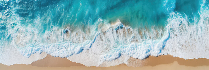 Drone perspective overlooking the clean and beautiful beach and waves
