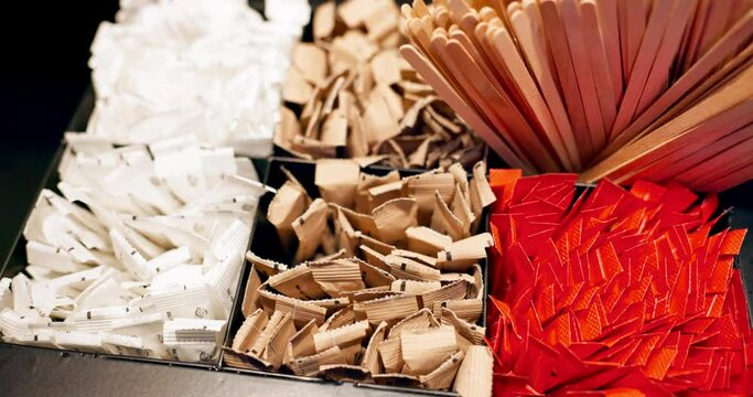 Hand, sugar and coffee packet with a person closeup from above in a cafe for beverage preparation. Box, drink and caffeine with a person making a cappuccino in a restaurant for self service