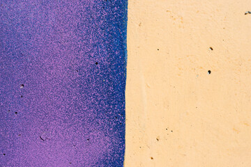 wall texture with purple and peach orange spray paint